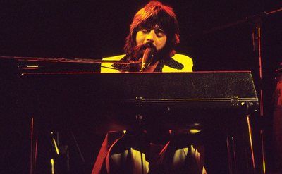 An image of Michael McDonald performing on stage.