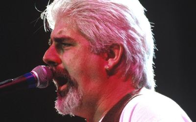 Michael McDonald performs on stage.