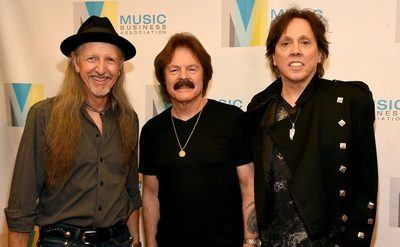 Patrick Simmons, Tom Johnston, and John McFee attend an event.