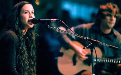 Alanis Morissette and her band perform at Neil Young's Bridge Benefit. 