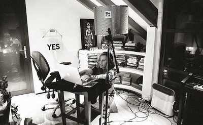Alanis Morissette is writing songs in the studio. 