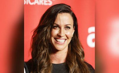 Alanis Morissette arrives at the 2015 MusiCares Person of The Year event. 