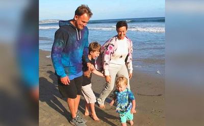 Alanis and her husband enjoy the day with their kids on the beach. 